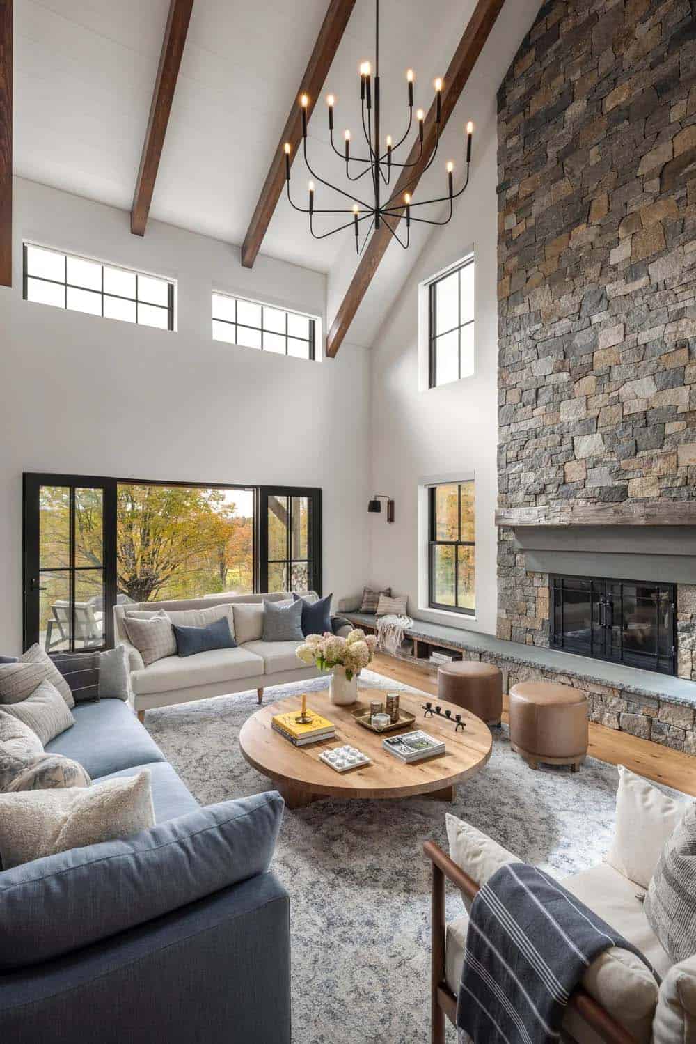 farmhouse style living room with a fireplace