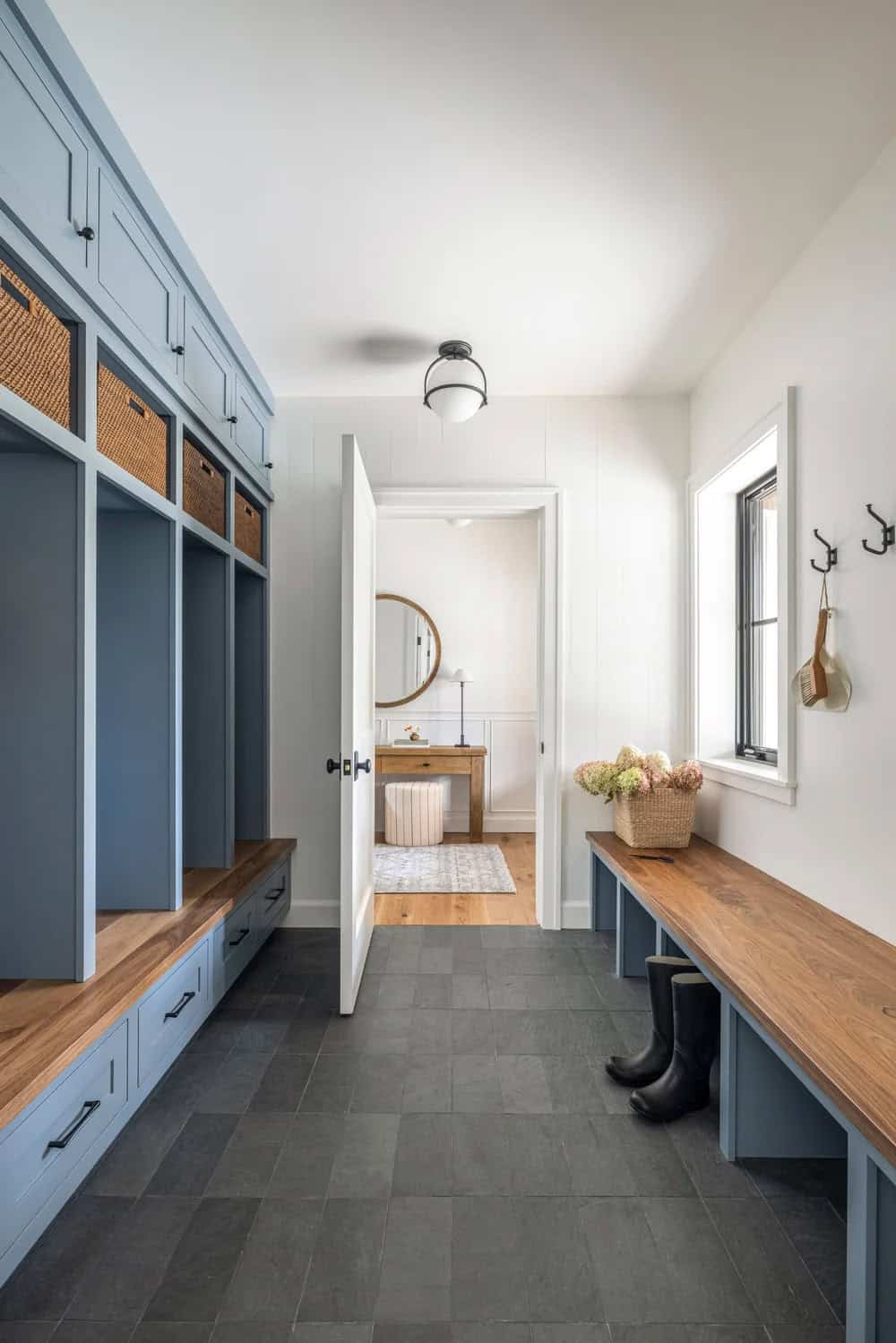 farmhouse style mudroom with a built-in bench and storage cubbies