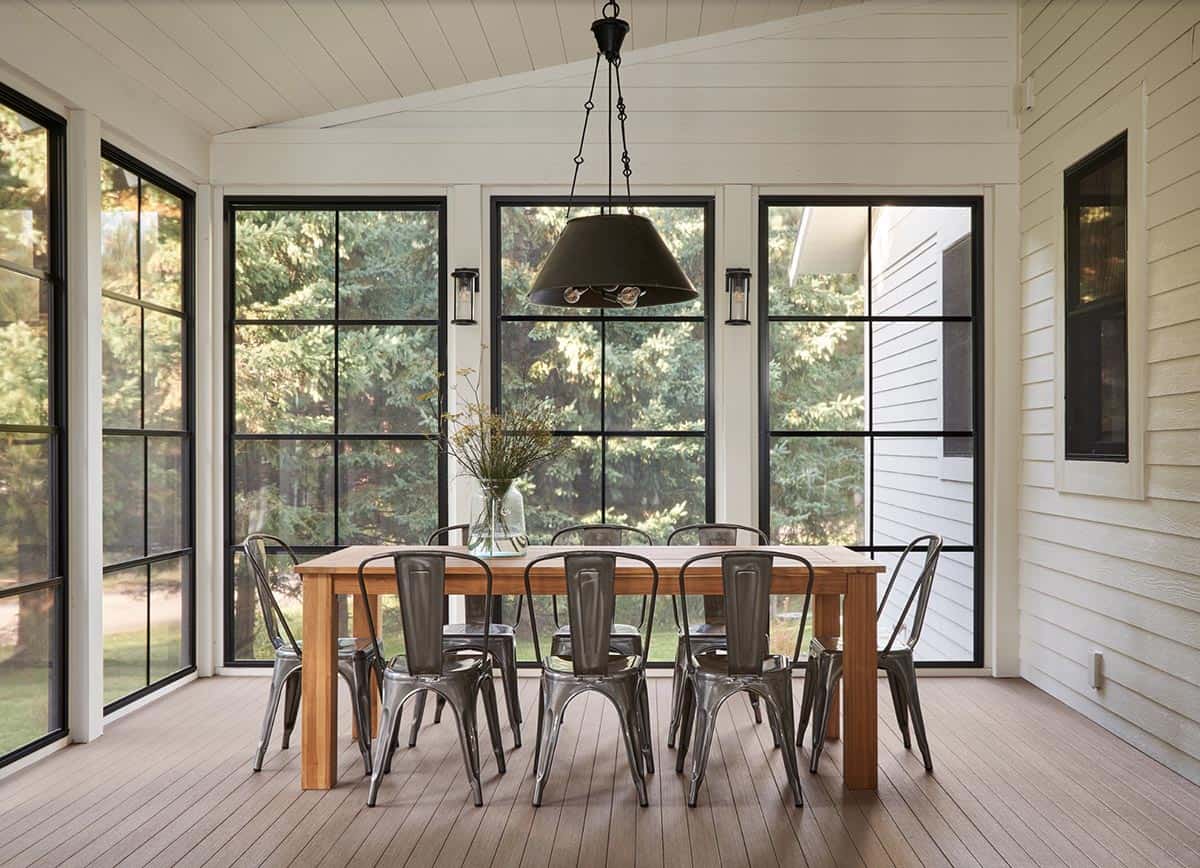 rustic three-season sunroom porch with a dining room