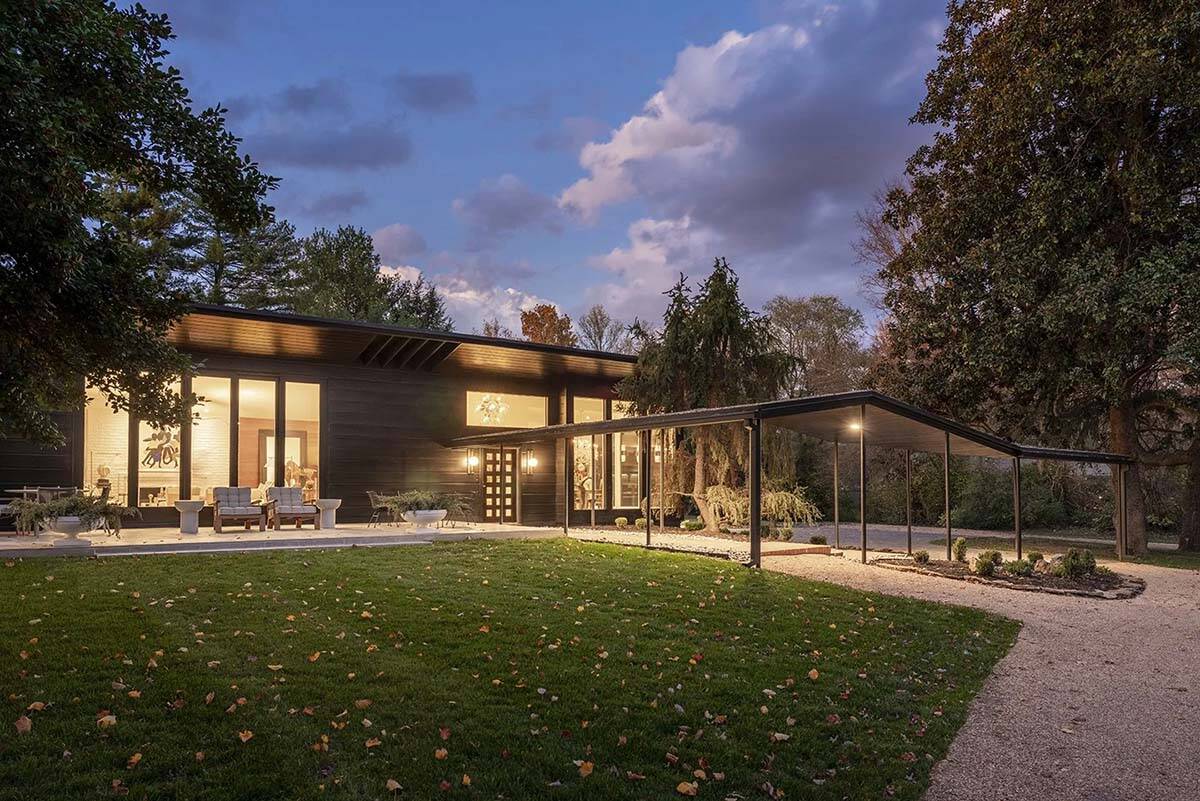 mid-century modern home exterior at dusk