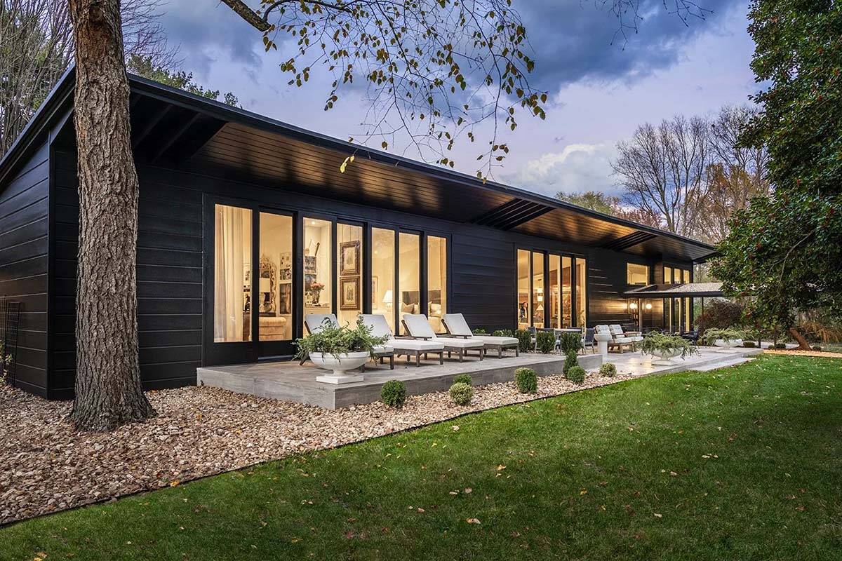 mid-century modern home exterior at dusk