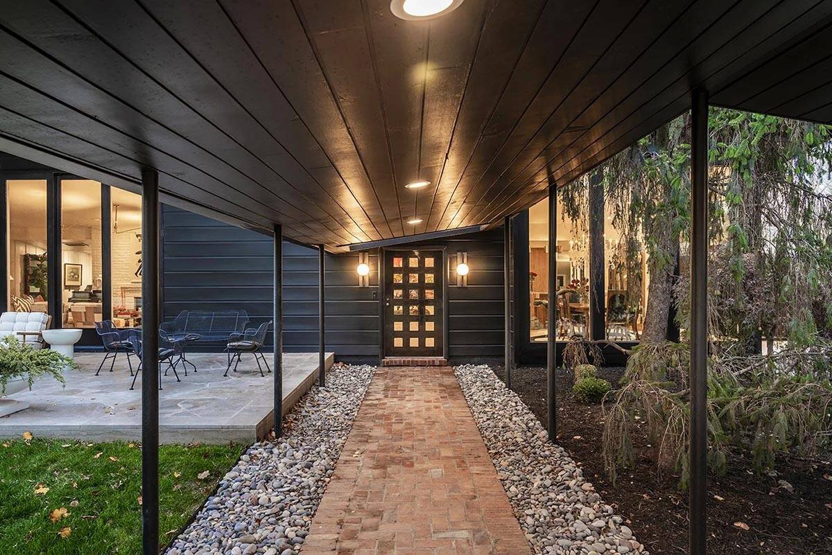 mid-century modern home exterior entry at dusk
