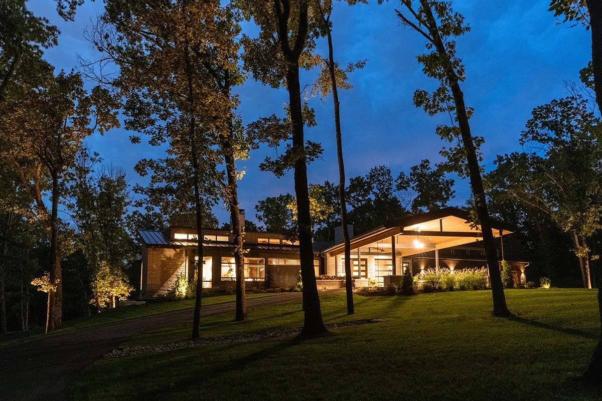 midcentury modern home exterior at dusk