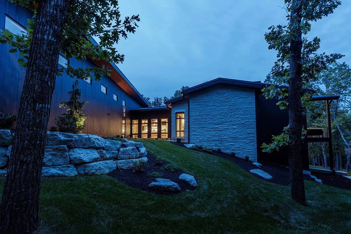 midcentury modern home exterior at dusk