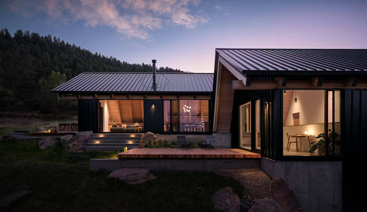 modern alpine cabin exterior at dusk