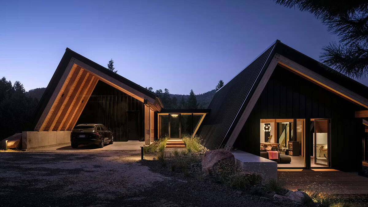 modern alpine cabin exterior at dusk