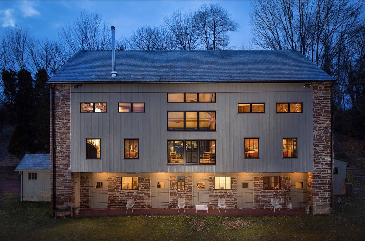 modern barn home exterior at dusk