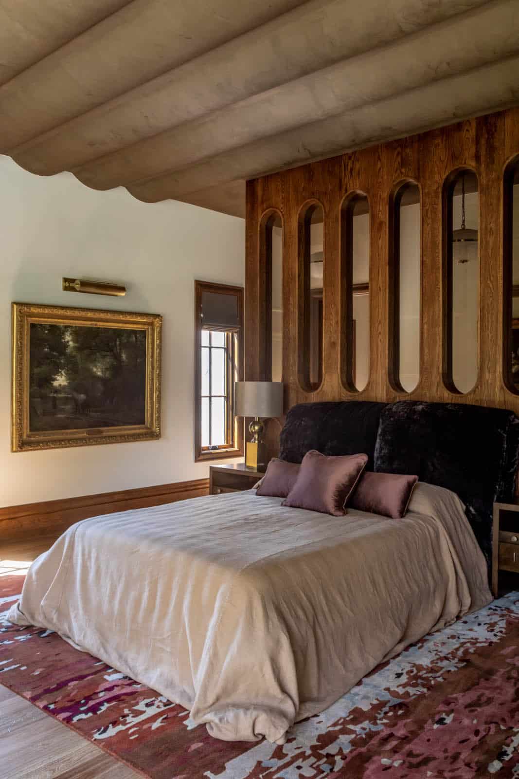 modern bedroom with a custom headboard