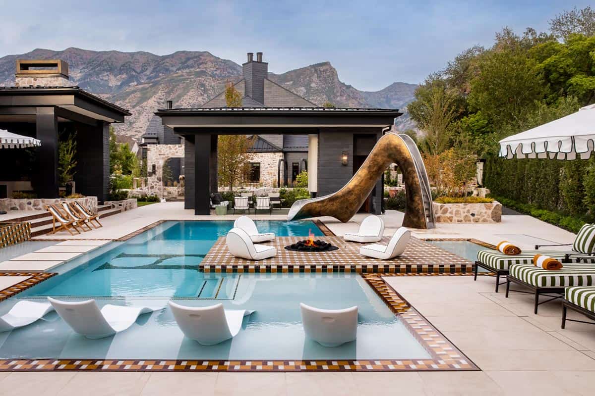 modern home exterior with a pool and slide