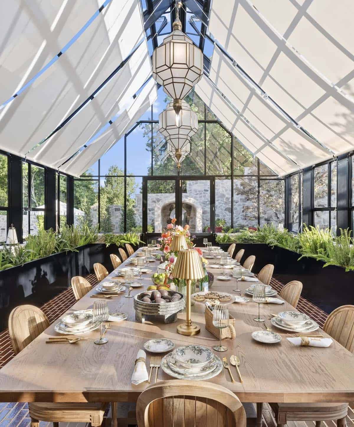 modern glass pavillion with a dining table