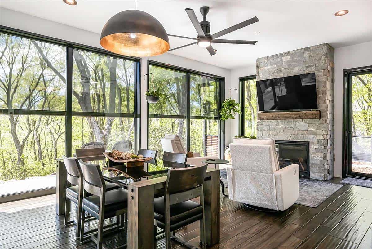 modern screened porch with a fireplace