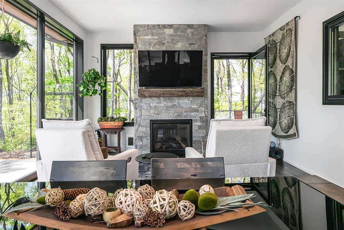 modern screened porch with a fireplace