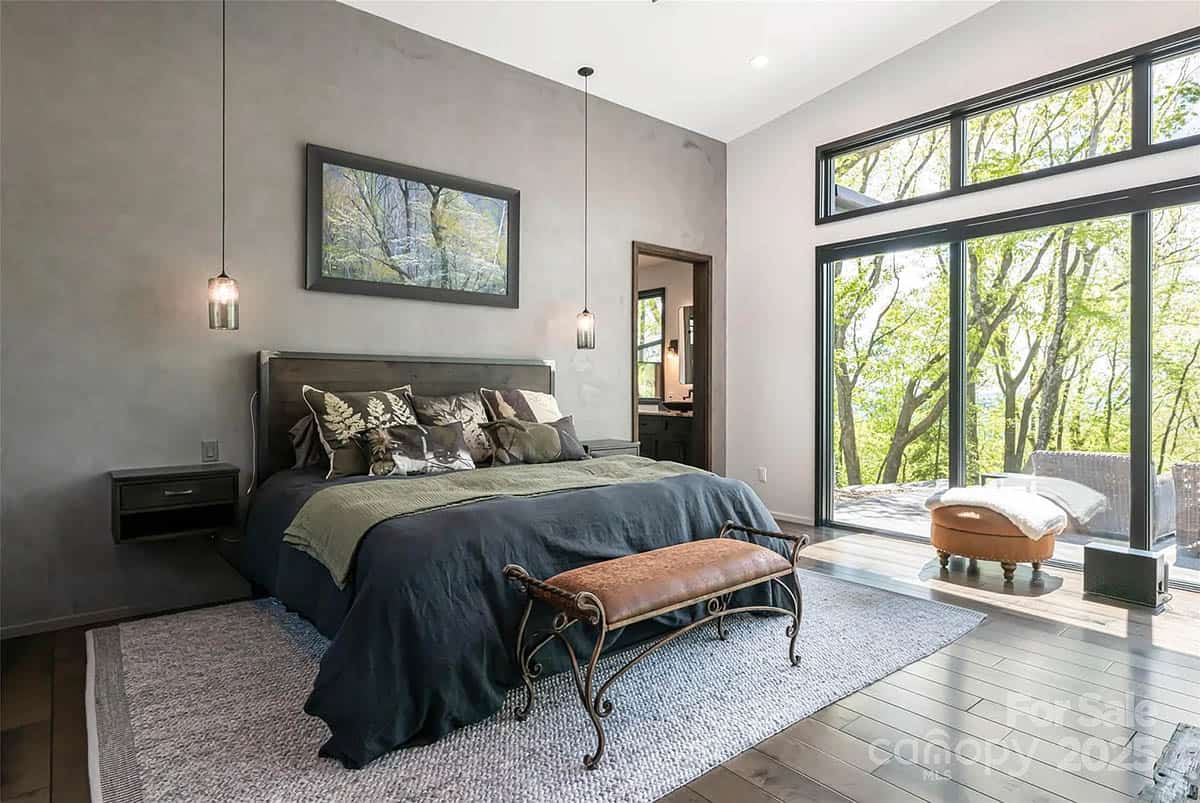 modern bedroom with a wall of glass