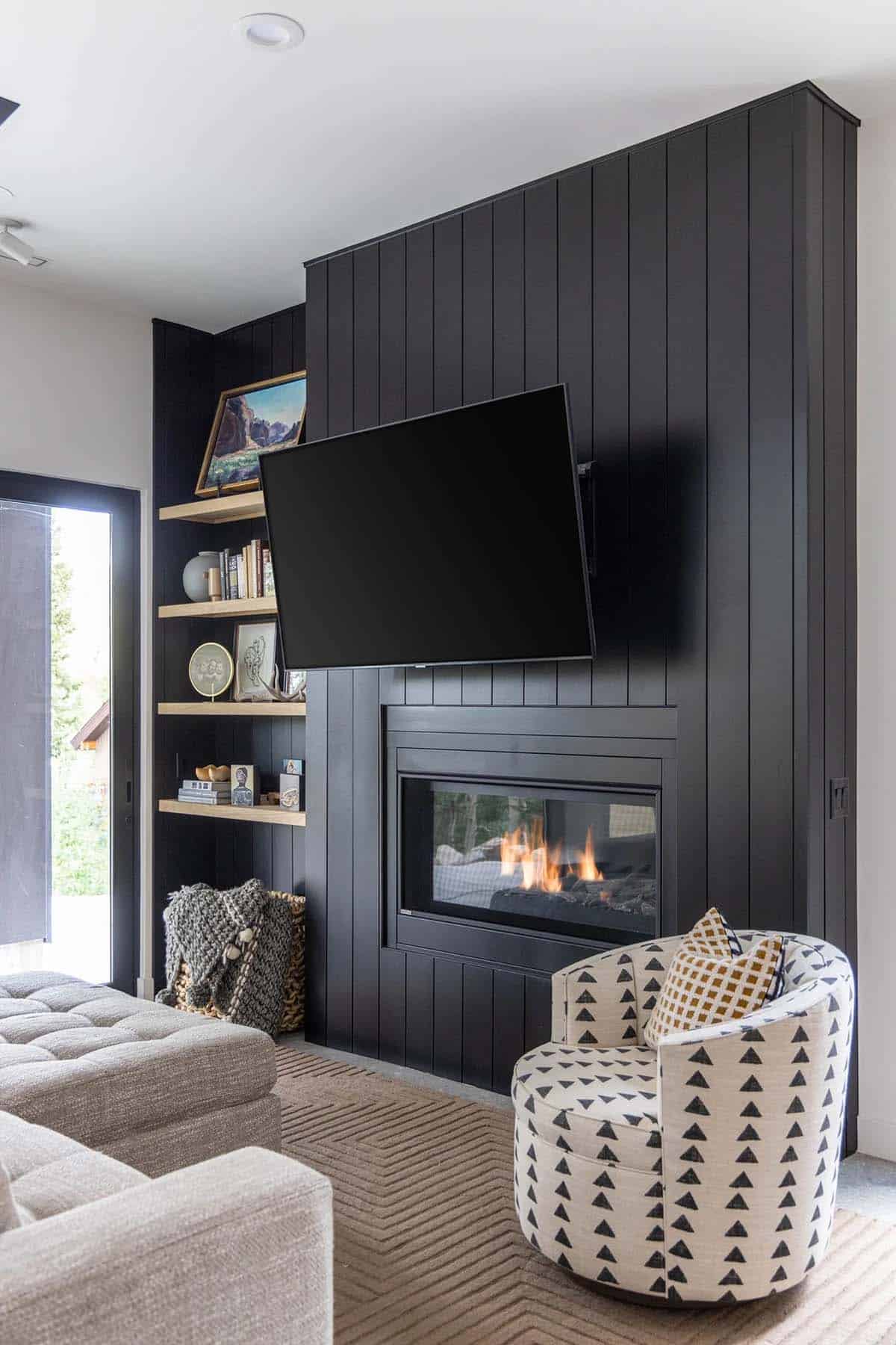 modern scandinavian style family room with a fireplace