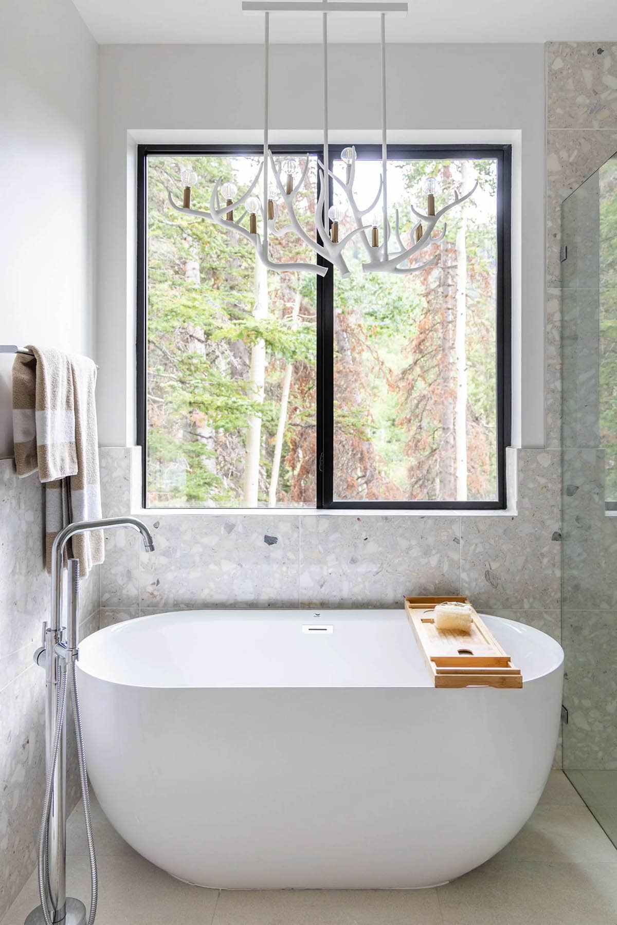 modern scandinavian style bathroom with a freestanding tub