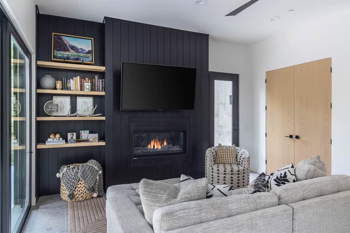 modern scandinavian style family room with a fireplace