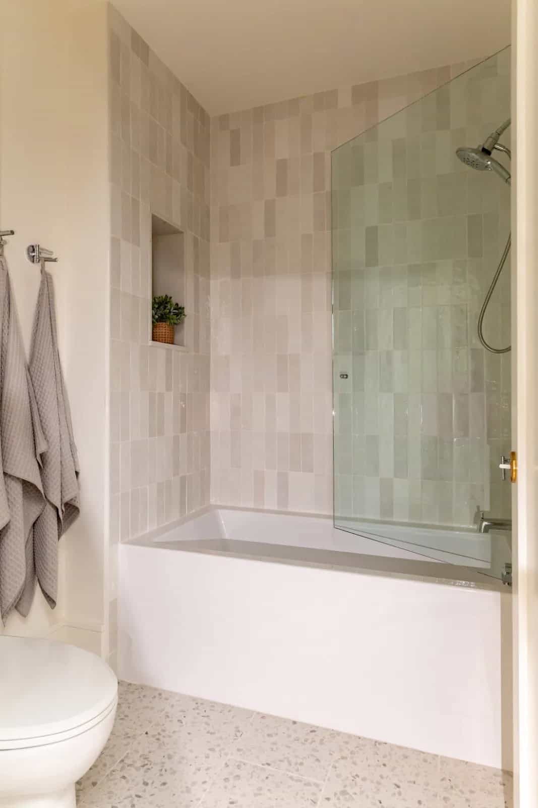 modern scandinavian style bathroom with an integrated tub