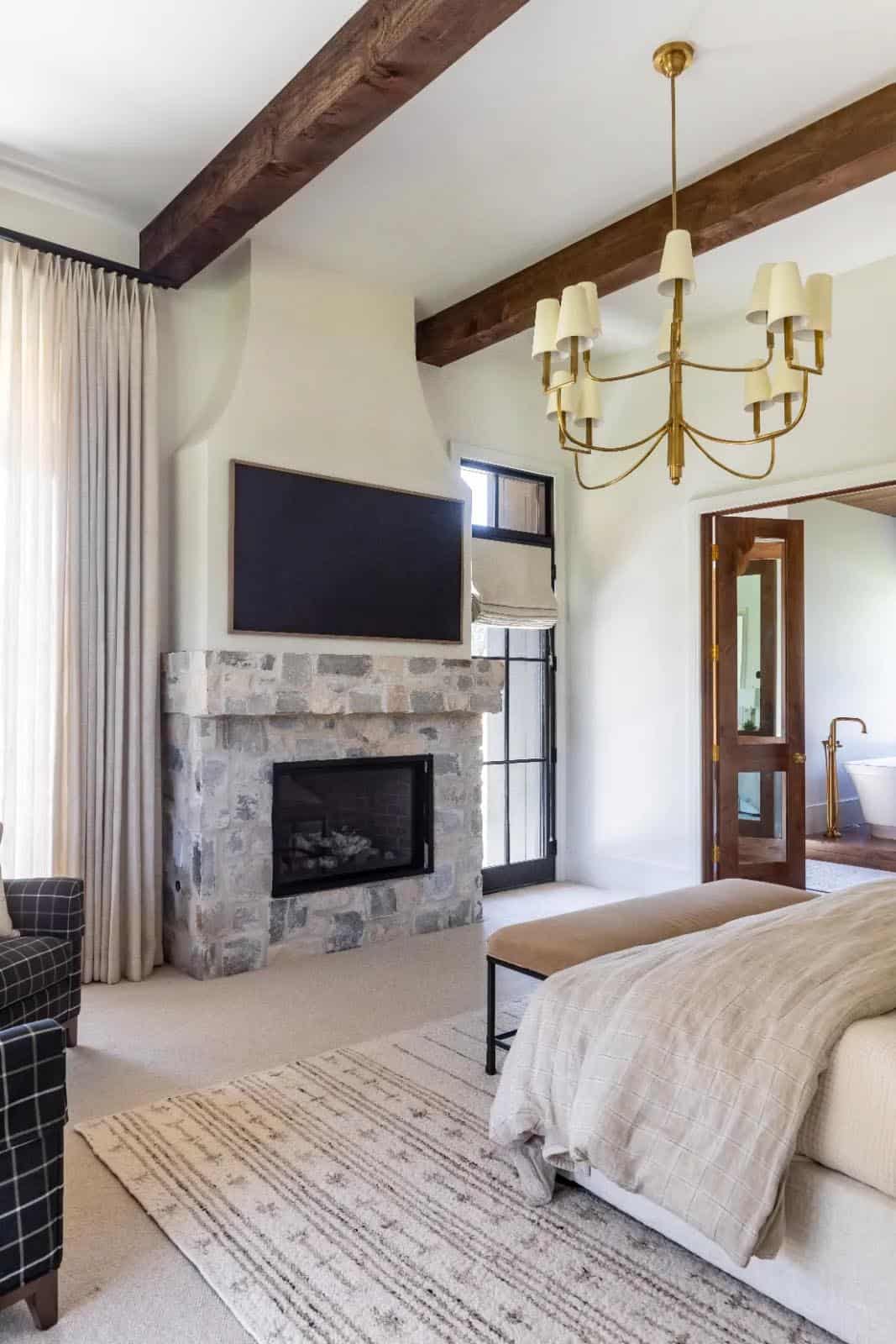 modern scandinavian style bedroom with a fireplace