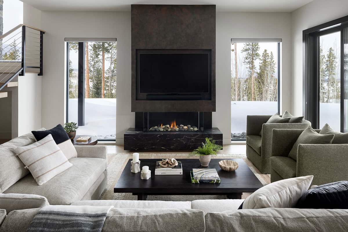 contemporary family room with a fireplace