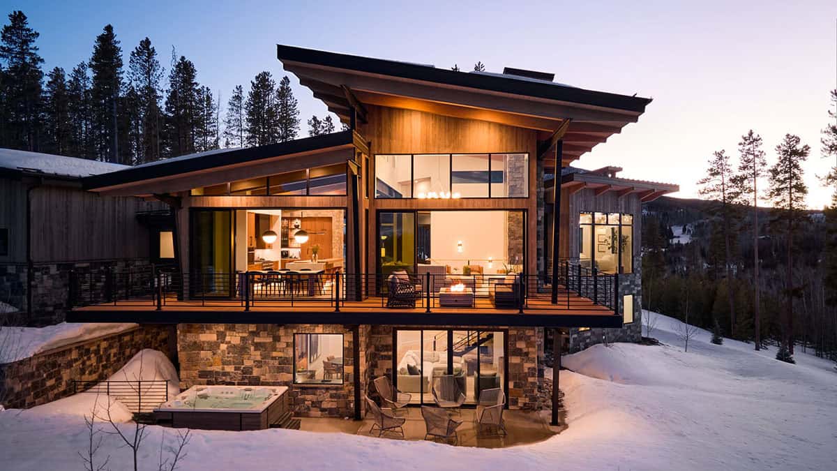 mountain contemporary home exterior with snow at dusk
