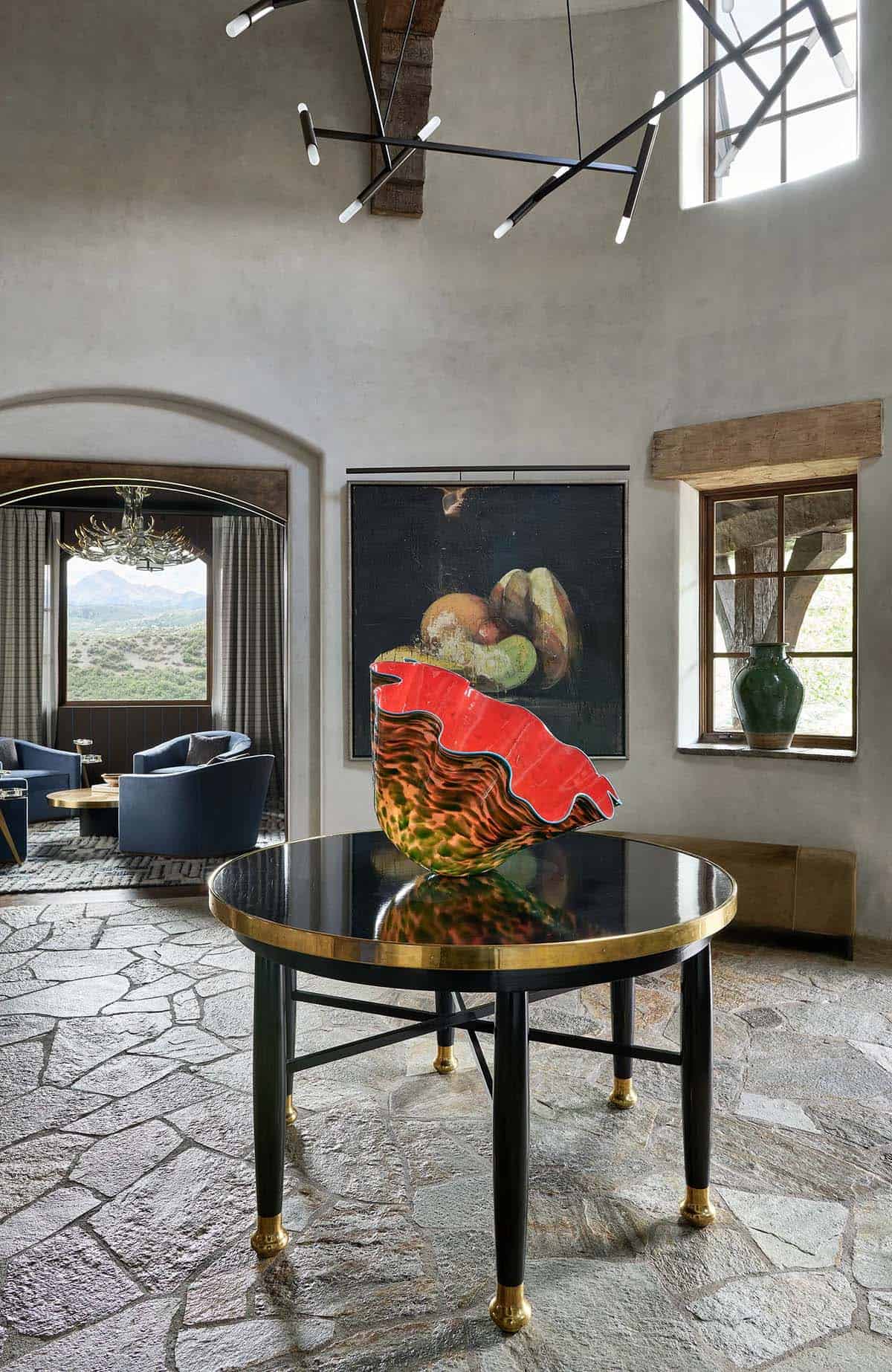 mountain lodge style home entry with a round table