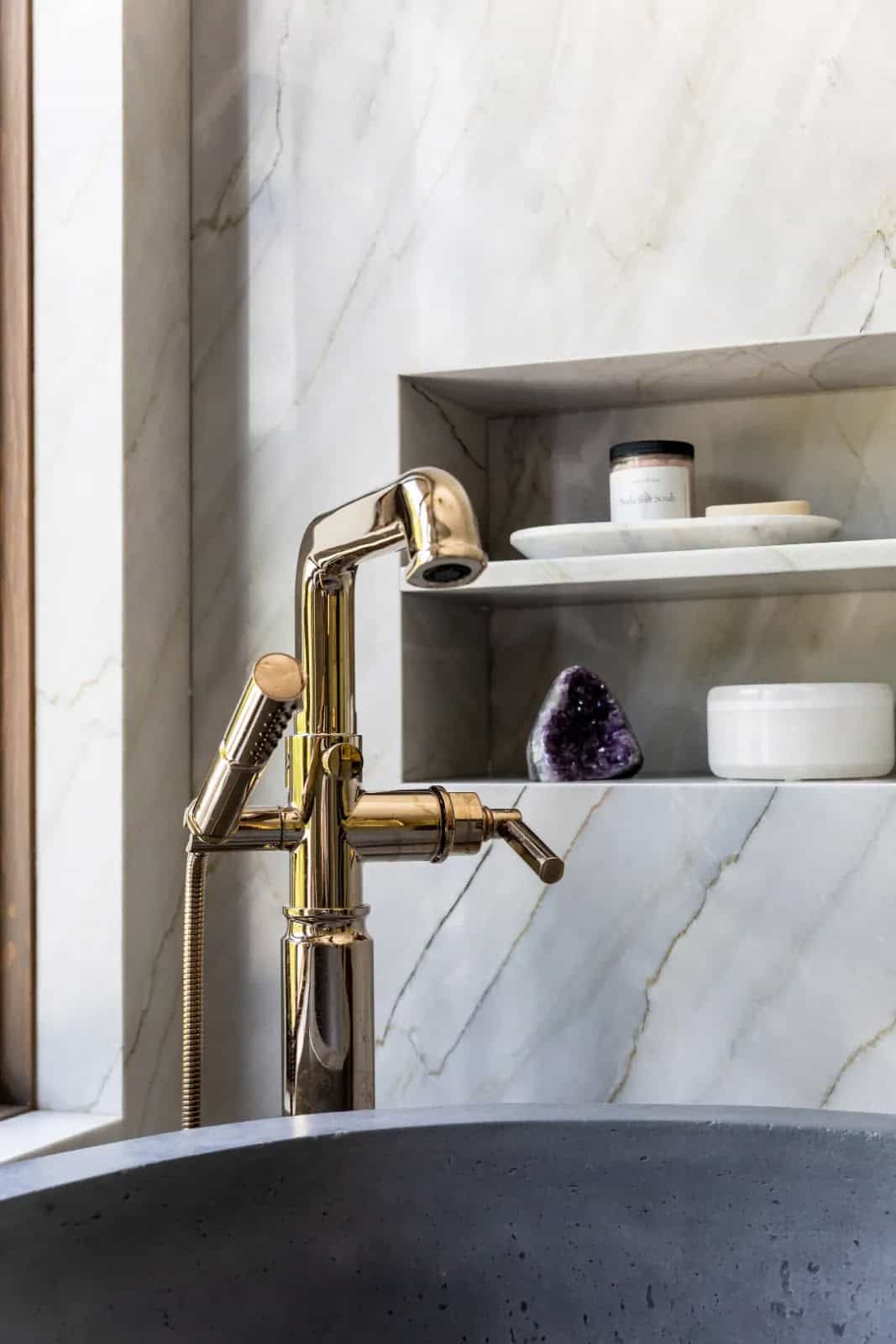 modern bathroom with a freestanding tub and a tub filler