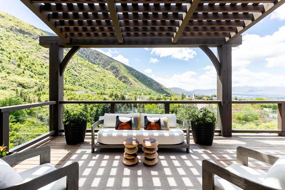 modern mountain home with a pergola covered deck