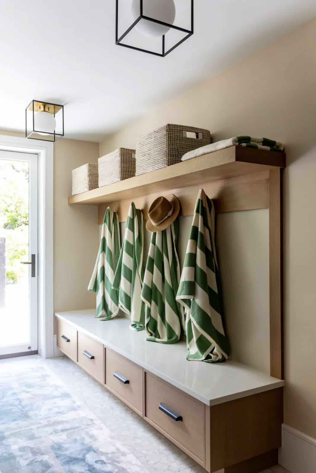 modern mudroom entry with a built-in storage bench
