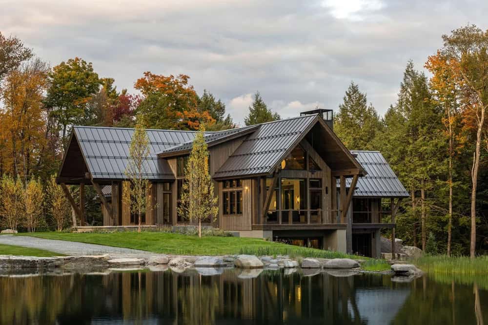 mountain ski home exterior with a view of the pond