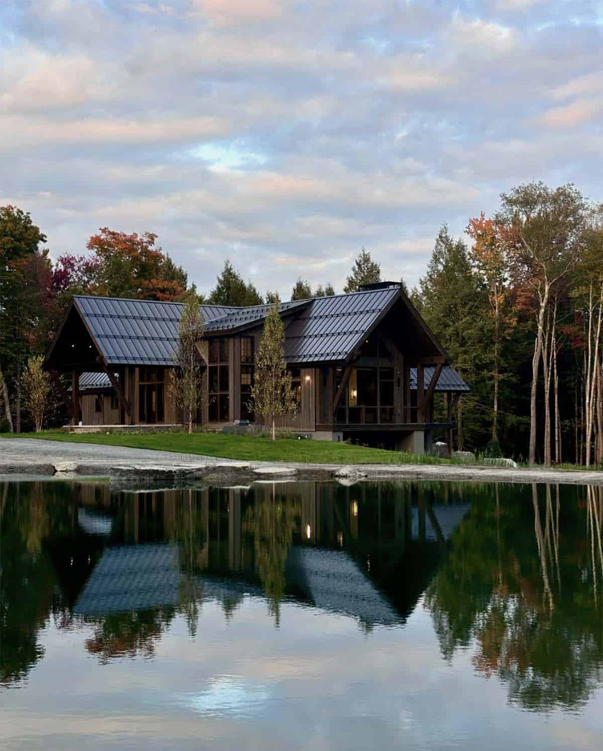 mountain ski home exterior with a view of the pond