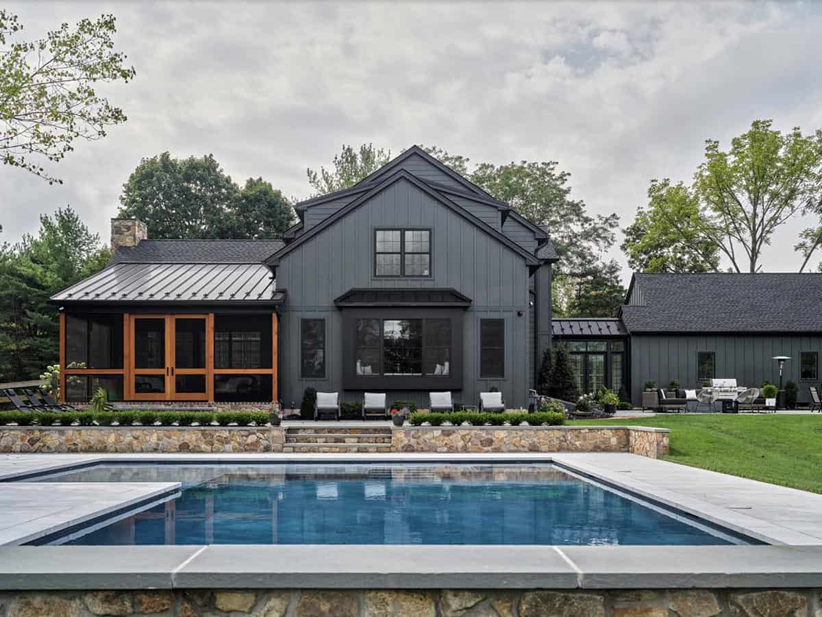 farmhouse home exterior with a pool