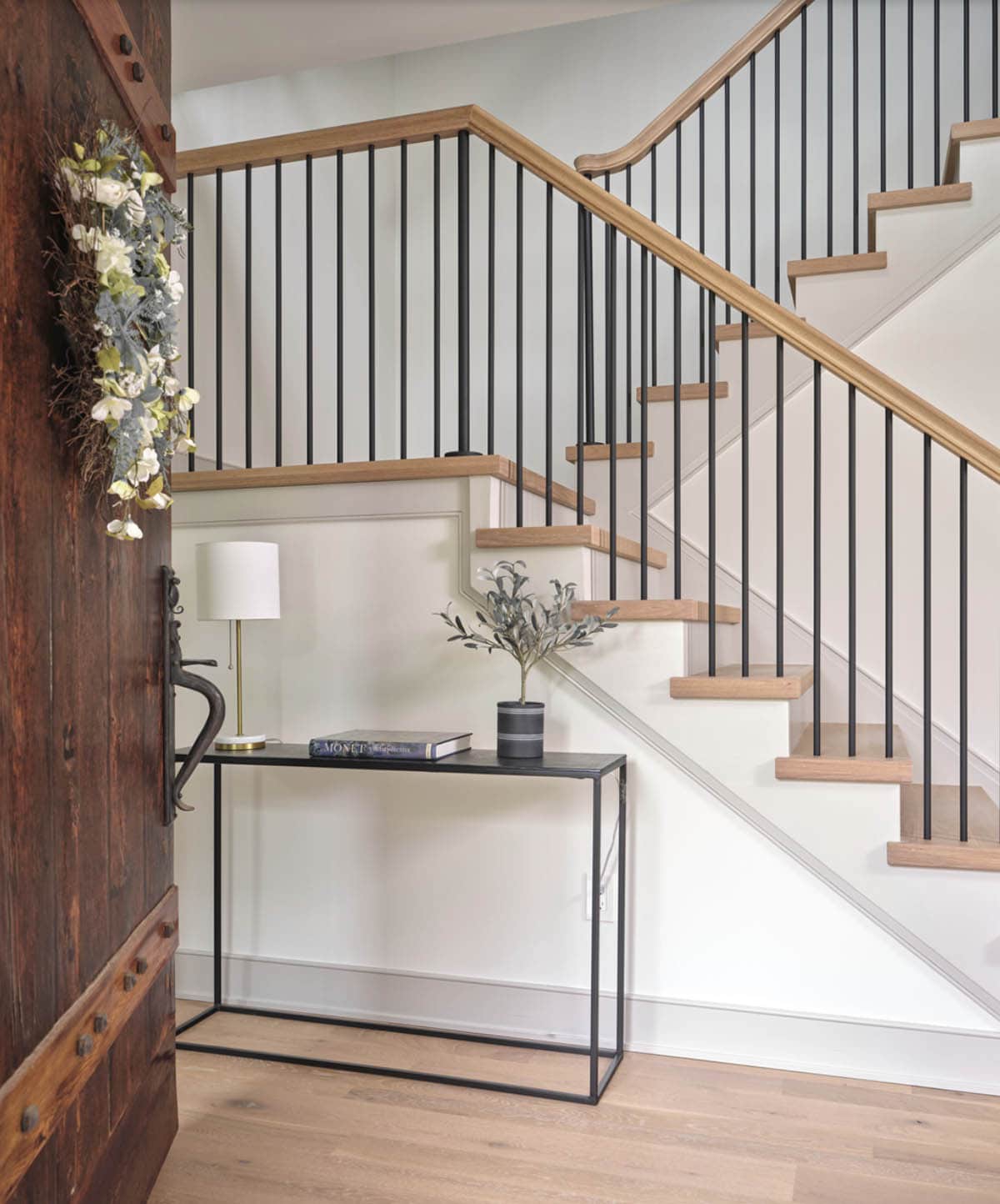 farmhouse style entry with a staircase