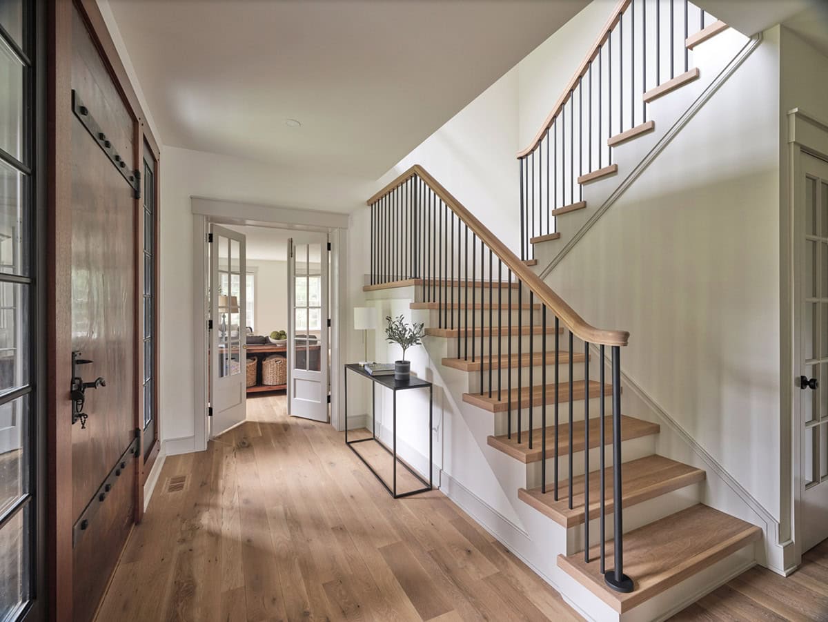 farmhouse style entry with a staircase