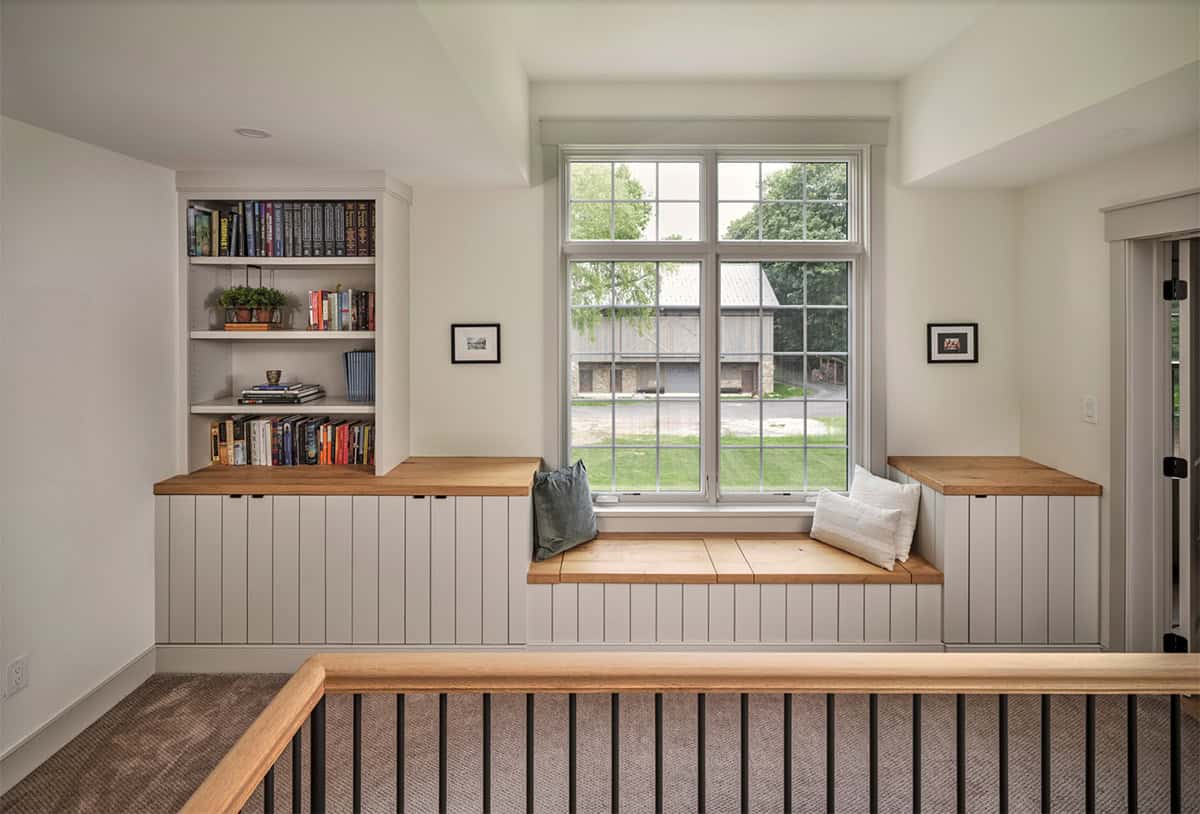 farmhouse style upstairs hallway with a built-in window seat