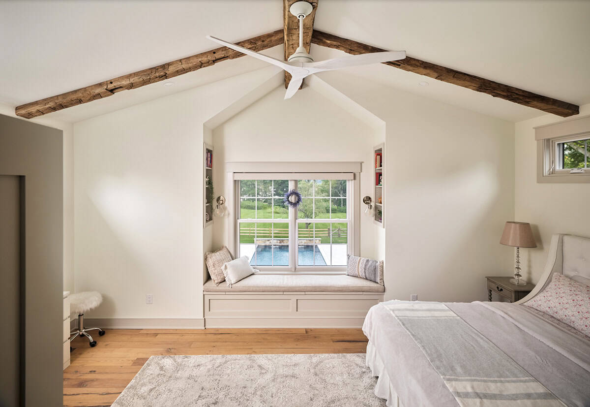 farmhouse style bedroom with a built-in window seat
