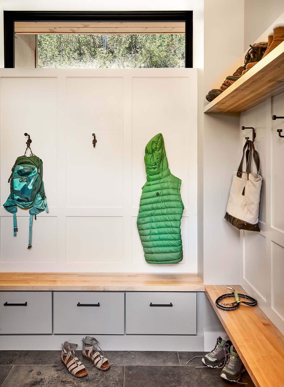 modern mudroom with bench seating and storage