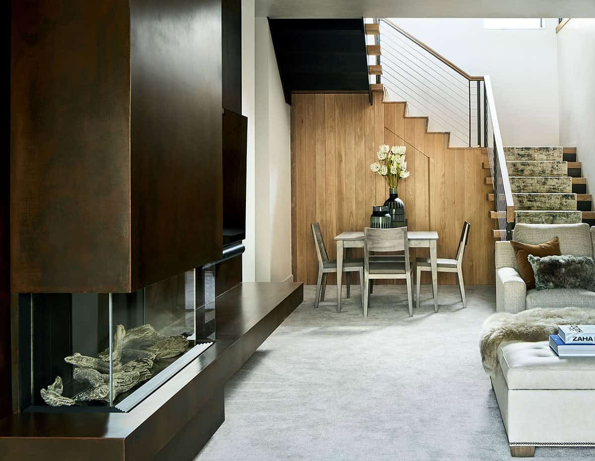 modern lower level with a fireplace