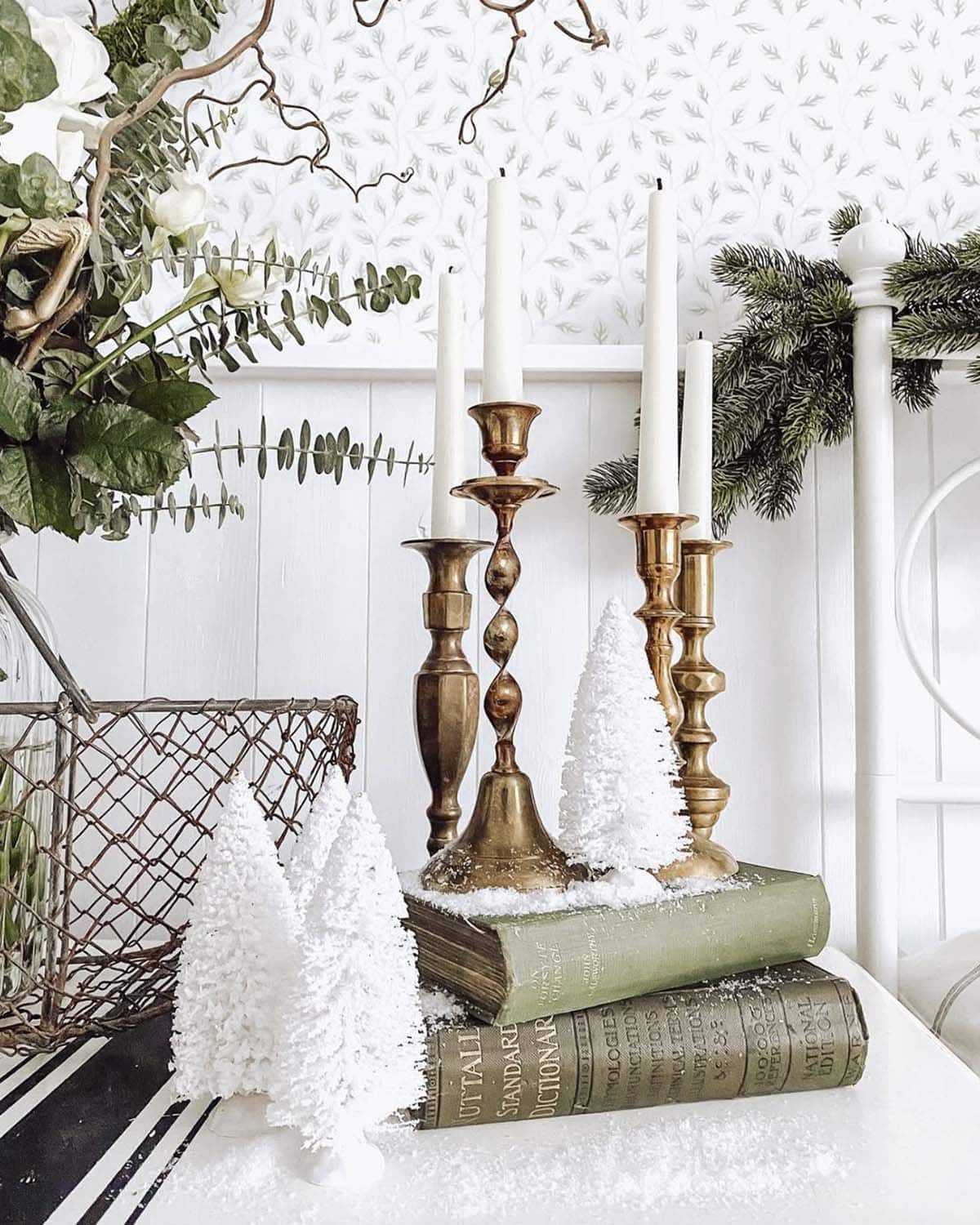 christmas vignette with a brass candle stick