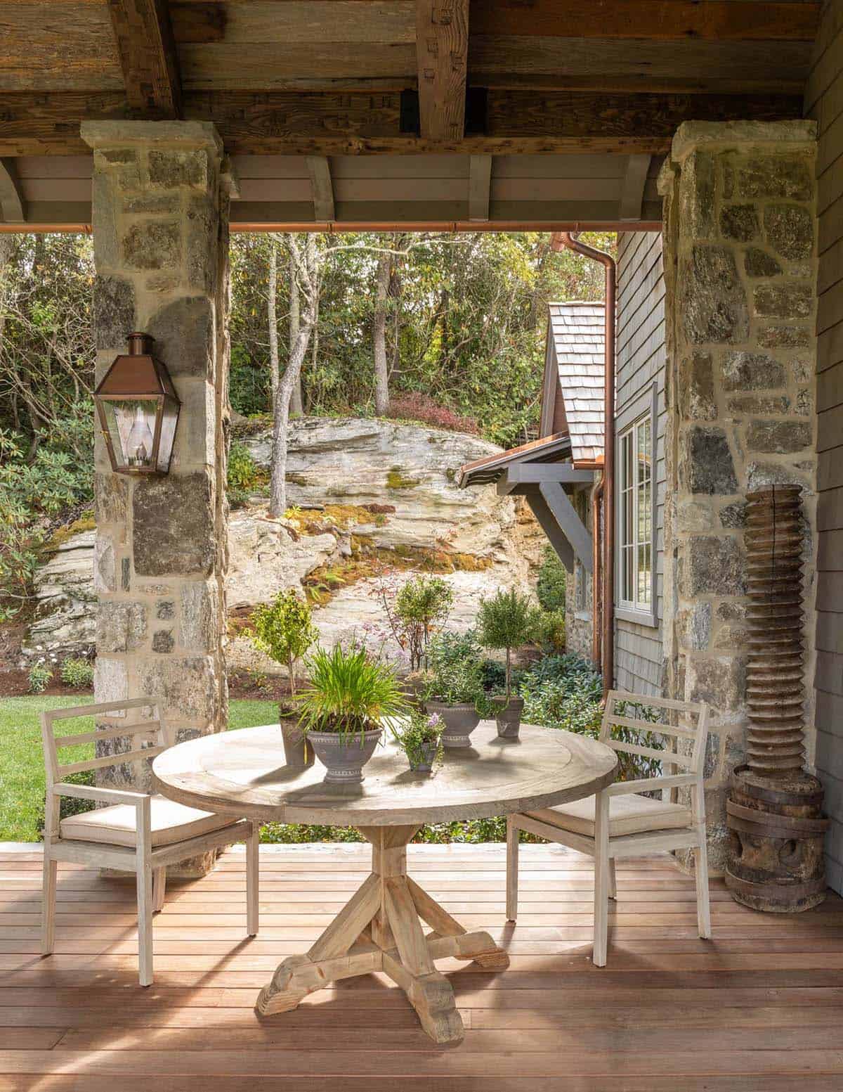 refined rustic covered porch with outdoor furniture