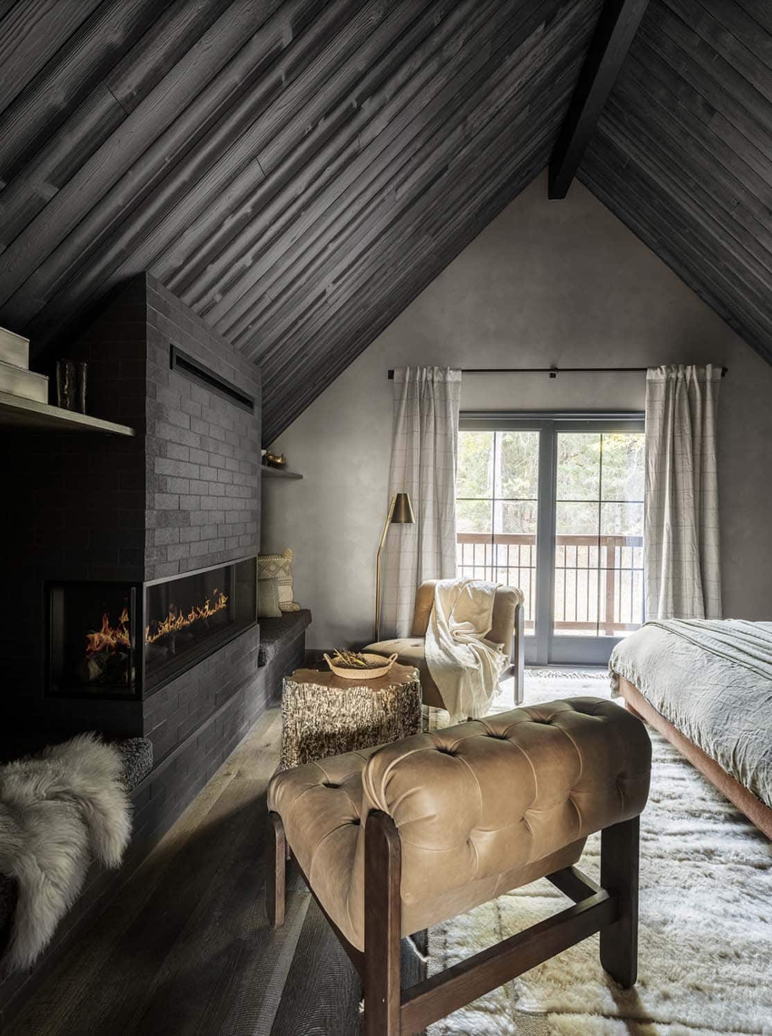 rustic bedroom with a fireplace
