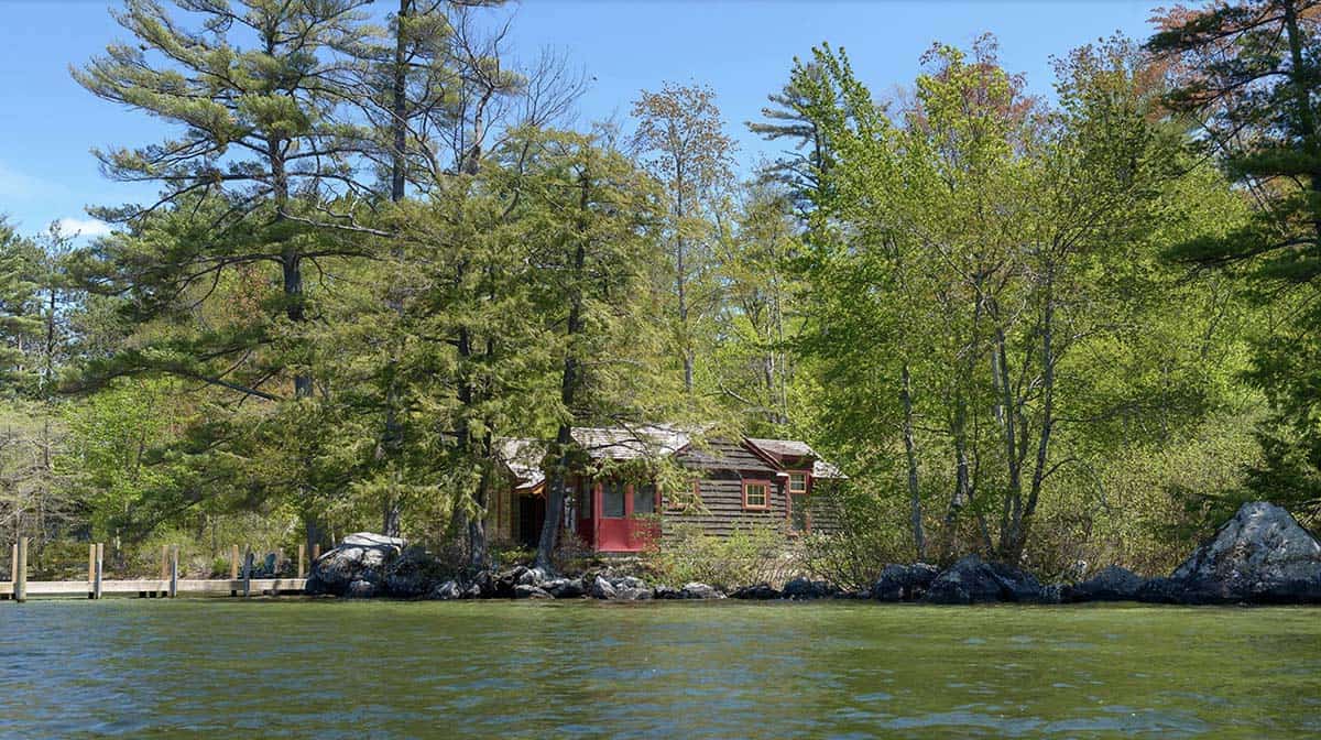 rustic lake house exterior with a water view