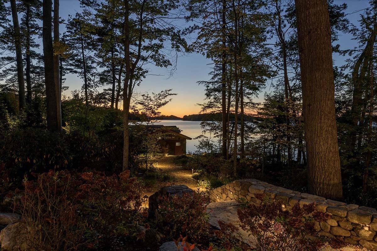 rustic lake house exterior at dusk