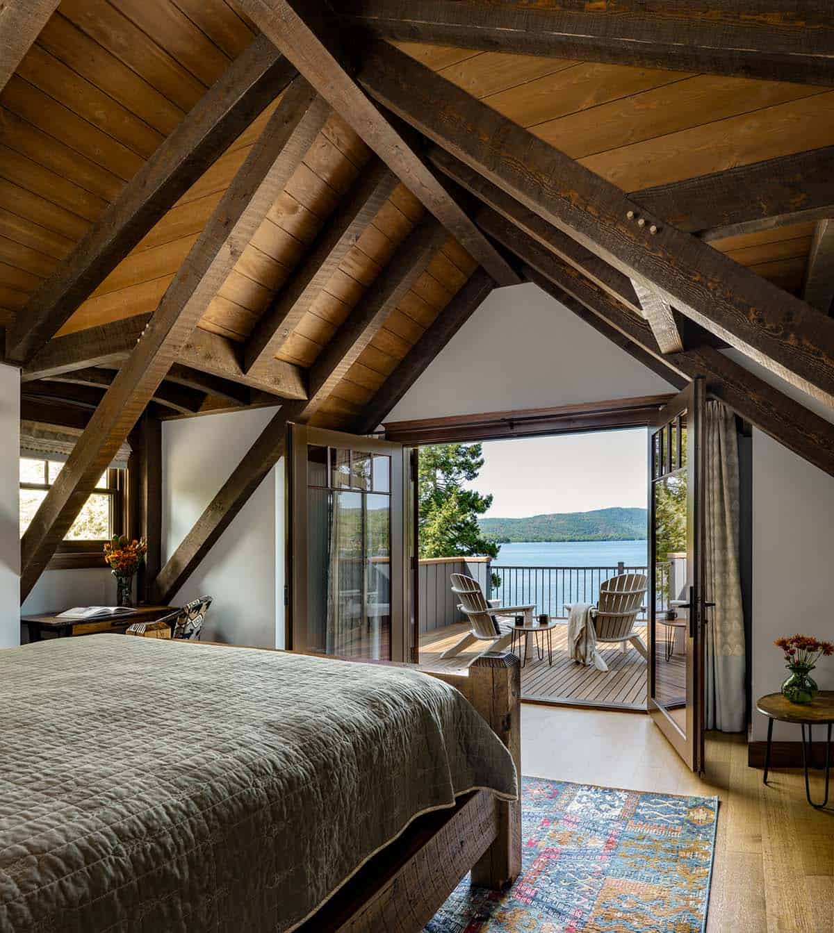 modern rustic bedroom with french doors overlooking the lake