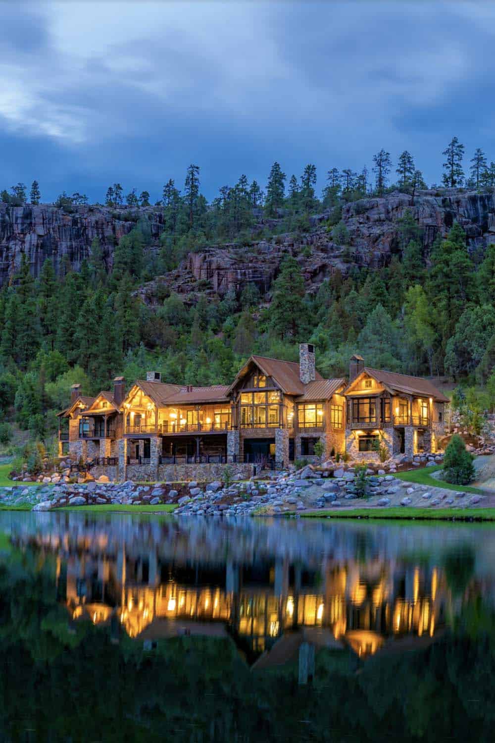 timber frame mountain house exterior at dusk