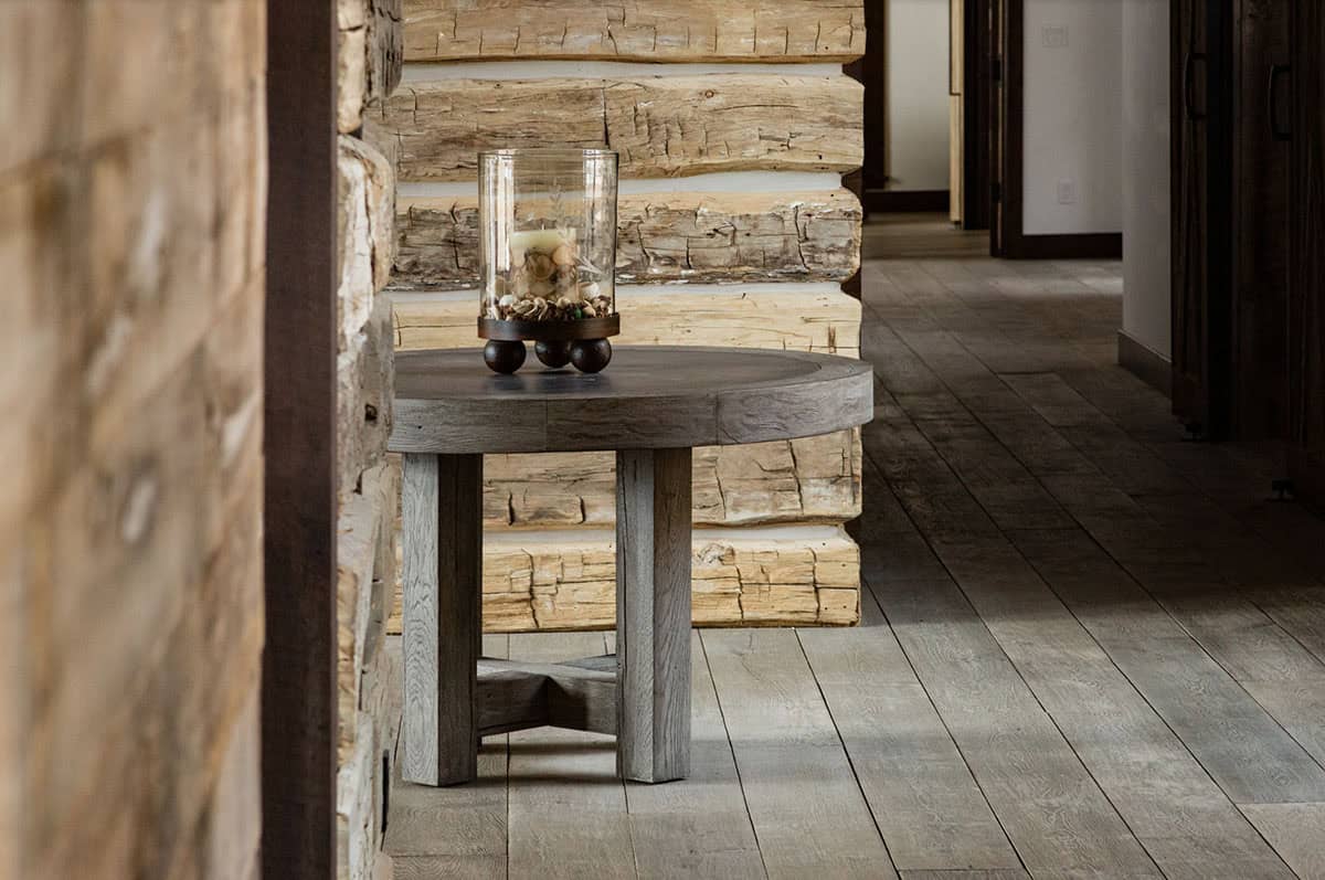 timber frame mountain house entry with a table