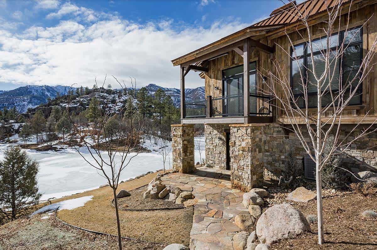 timber frame mountain house exterior with snow