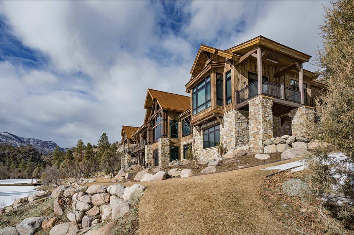 timber frame mountain house exterior with snow