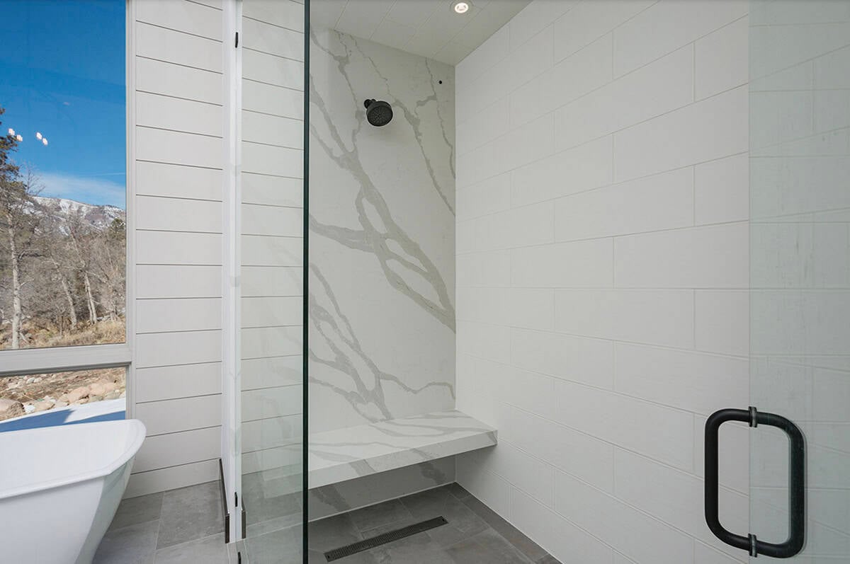 rustic bathroom with a glass shower