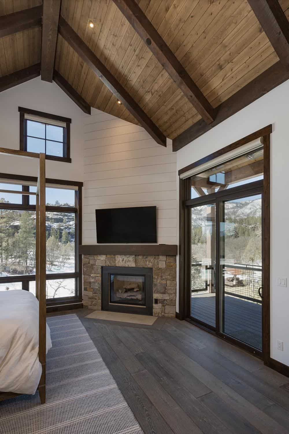 rustic bedroom with a fireplace