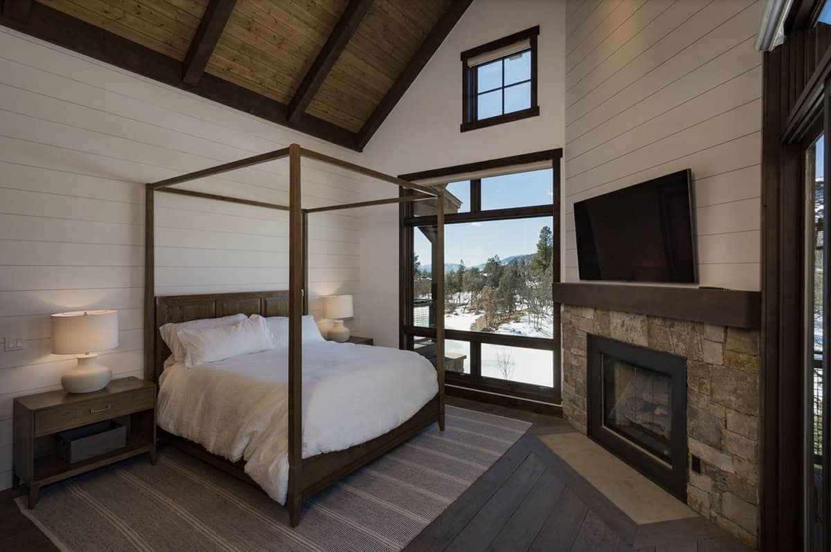 rustic bedroom with a fireplace